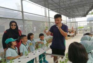 Preschoolers Listening at an Outdoor Farm Program -  Educational Field Trips in Singapore