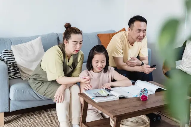 Asian parents making sure their kids learning properly