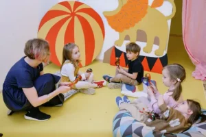 How to choose a preschool- preschool teacher interacting with kids