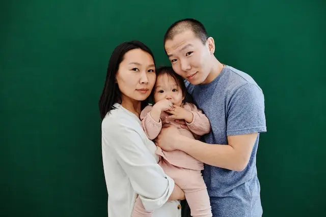 Asian couple with their children, representing the diversity in family structures in Singapore