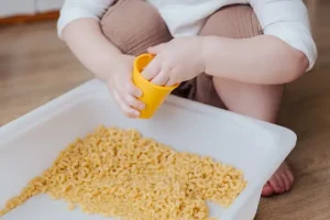 Child playing at home- Sensory Play Ideas
